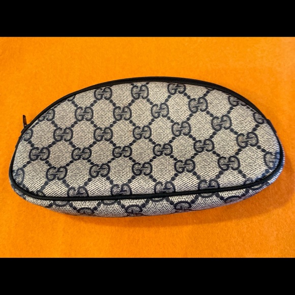 Gucci Handbags - Authentic Gucci navy blue and gray cosmetic bag